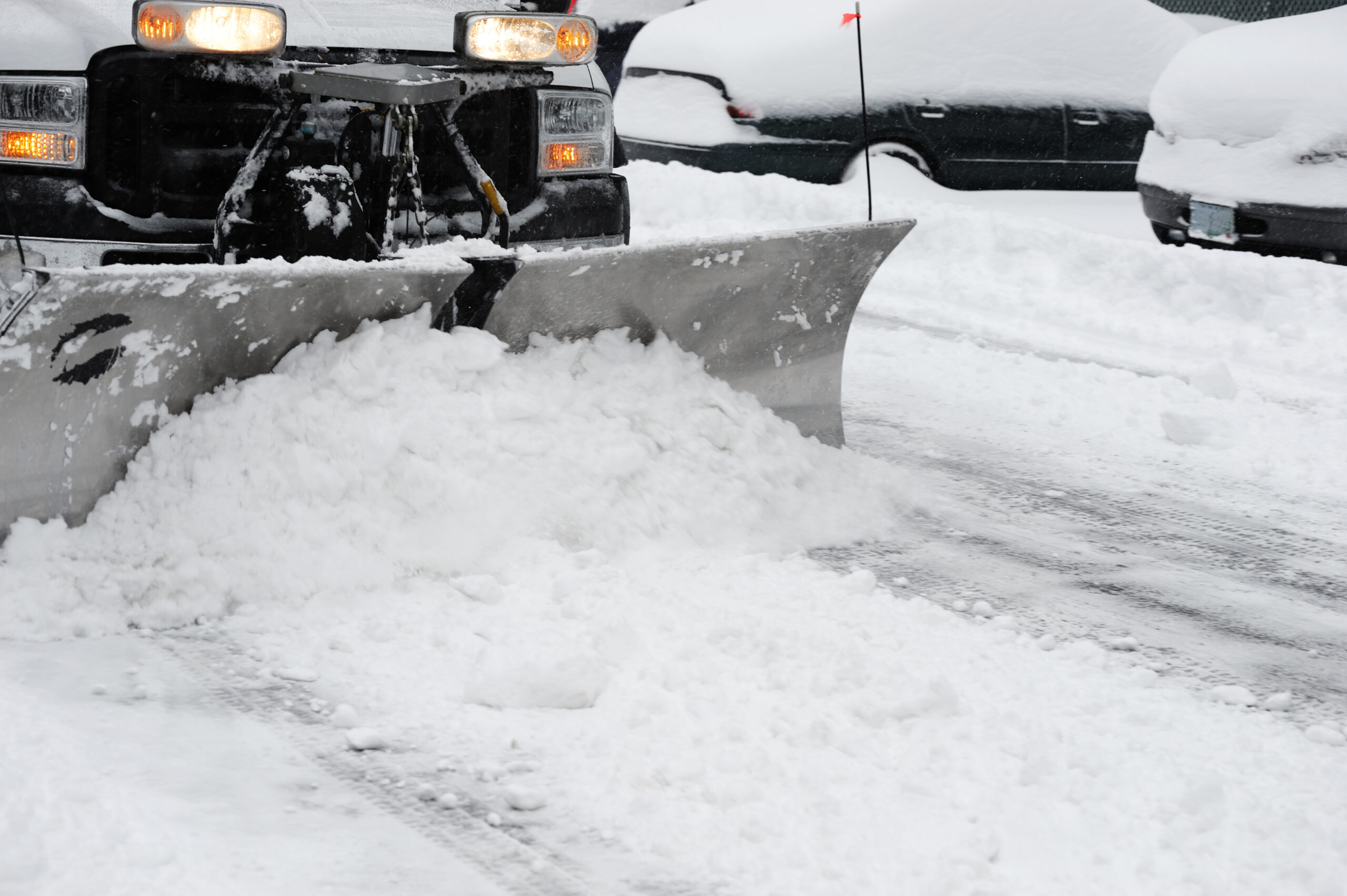 snowplow removing snow on the street